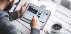 men-using-stylus-pen-for-touching-the-digital-tablet-screen-diversity news magazine