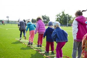Kids together in jumping competition